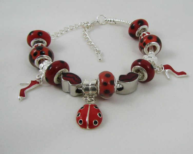 Pulsera de plata con mariquitas rojas