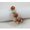 Pulsera de plata con cuentas naranjas y lazo