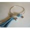 Bracelet jonc perles et pompon bleu sarcelle