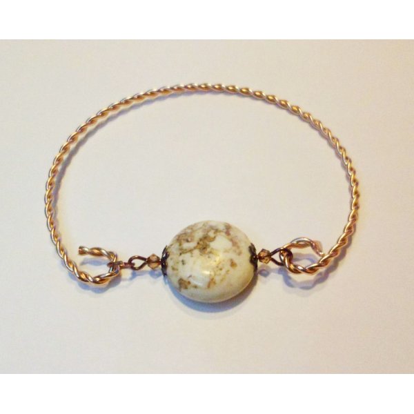 Bracelet jonc torsad&eacute; coloris or rose