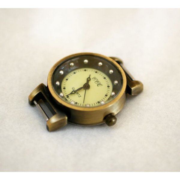 Esfera de reloj de muelle negra y bronce